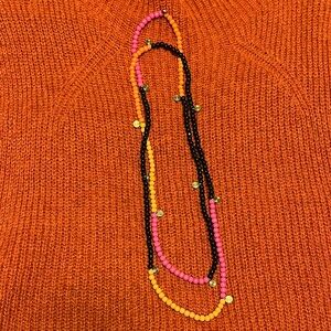 Gudrun Sjoden beads - orange, pink, black, with spiral metal accent beads